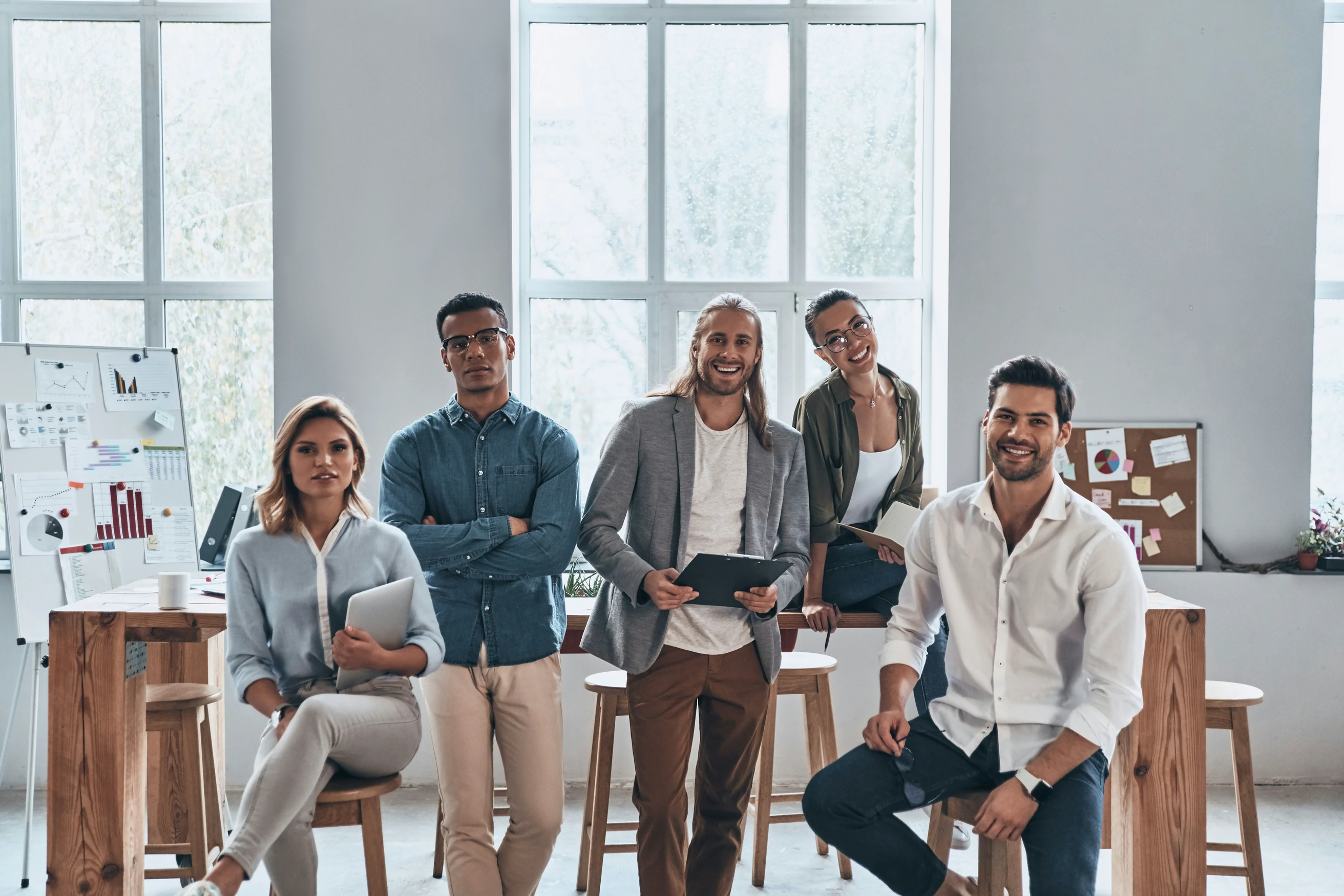 Developify's property team standing together in a bright office